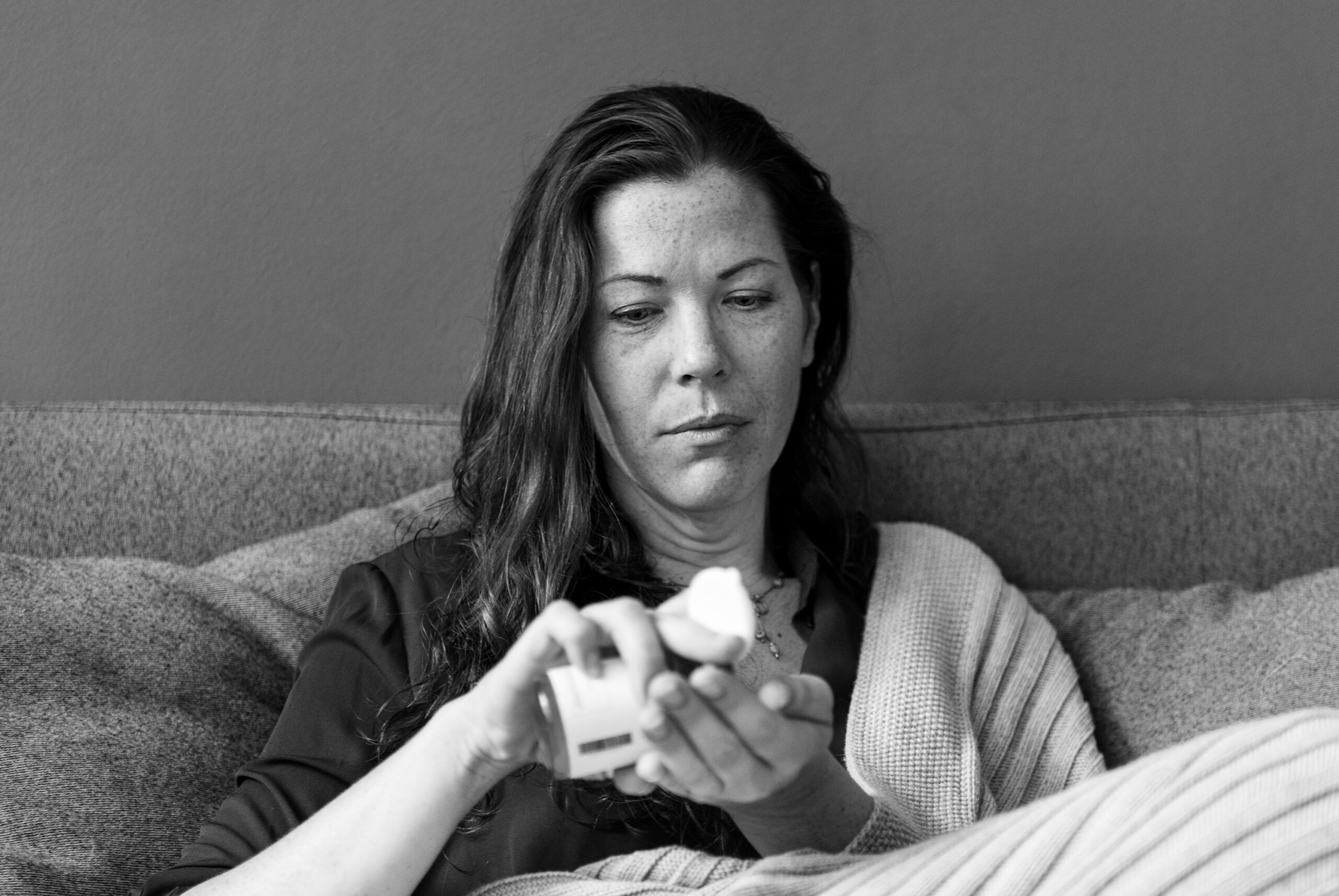 Woman sick on the sofa